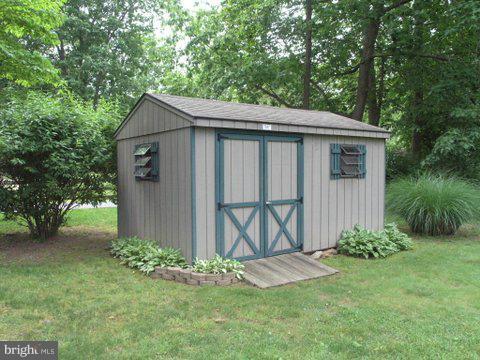 5218 Forge Road Perry Hall, MD 21128 - Photo 17 of 22 a view of barn with a yard potted plants and large tree