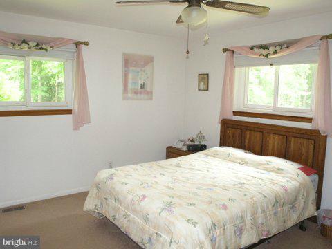 5218 Forge Road Perry Hall, MD 21128 - Photo 5 of 22 a bedroom with a bed and a window
