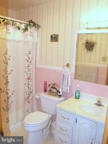 5218 Forge Road Perry Hall, MD 21128 - Photo 7 of 22 a bathroom with a sink toilet vanity and shower