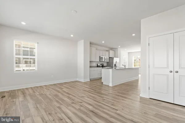 a view of kitchen and kitchen with wooden floor
