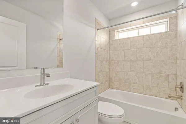 a bathroom with a sink toilet and bathtub