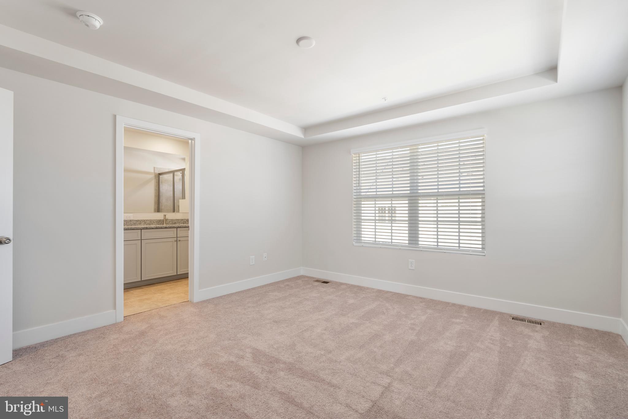 7550 Johnnycake Road Windsor Mill, MD 21244 - Photo 26 of 36 an empty room with windows and closet