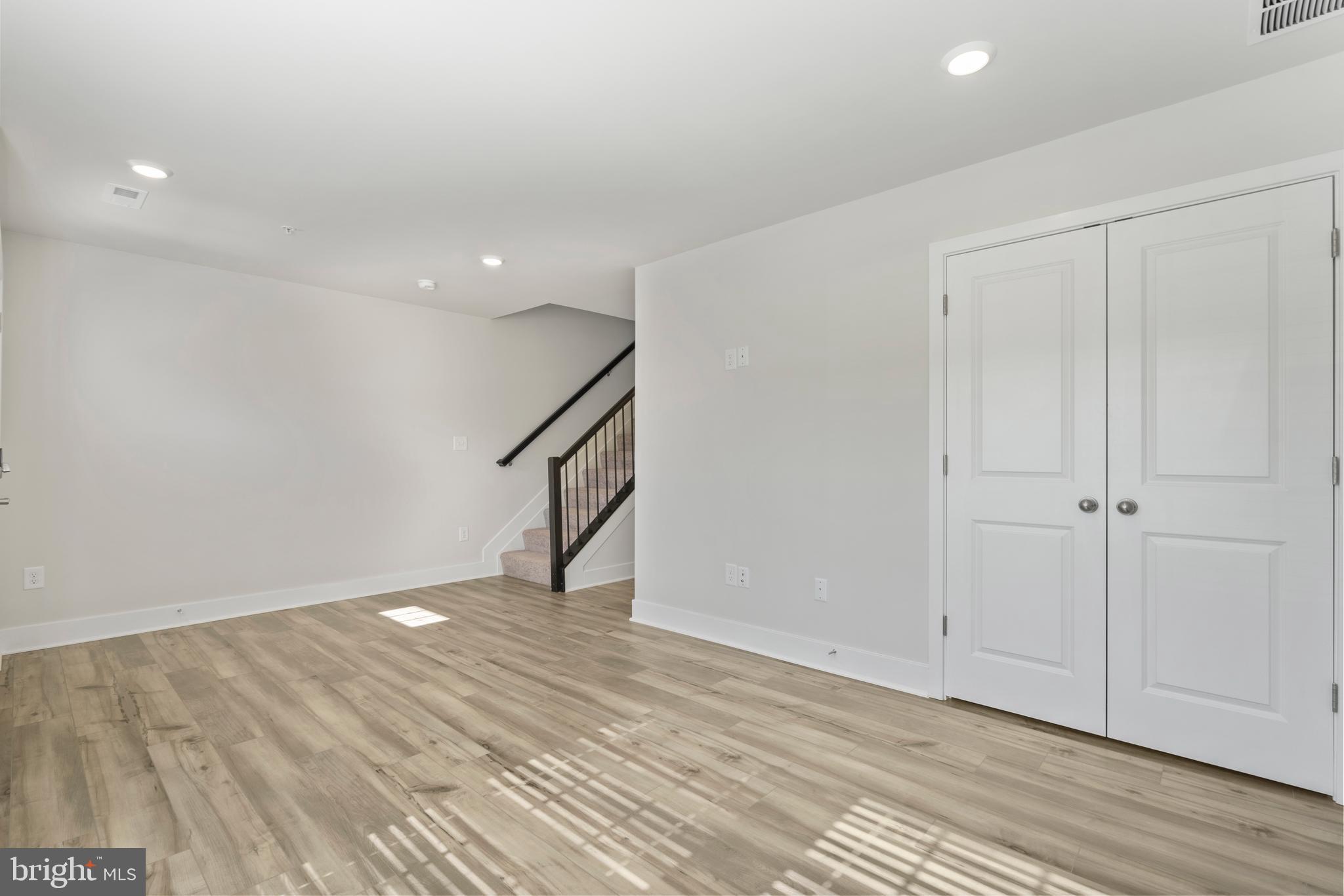 7550 Johnnycake Road Windsor Mill, MD 21244 - Photo 32 of 36 a view of an empty room with wooden floor