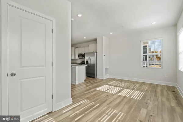a view of kitchen with wooden floor