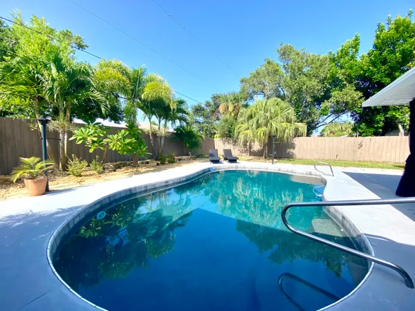a view of a swimming pool with an outdoor space