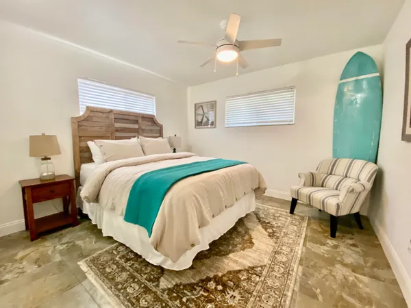 a bedroom with a bed and a mirror