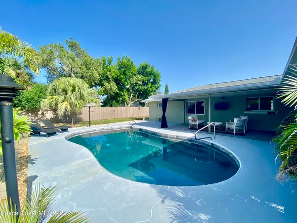 a view of a swimming pool with a patio