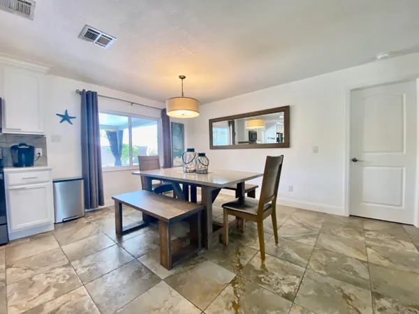 a view of a dining room with furniture