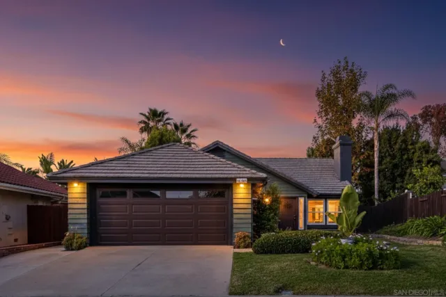 a front view of a house with a garage
