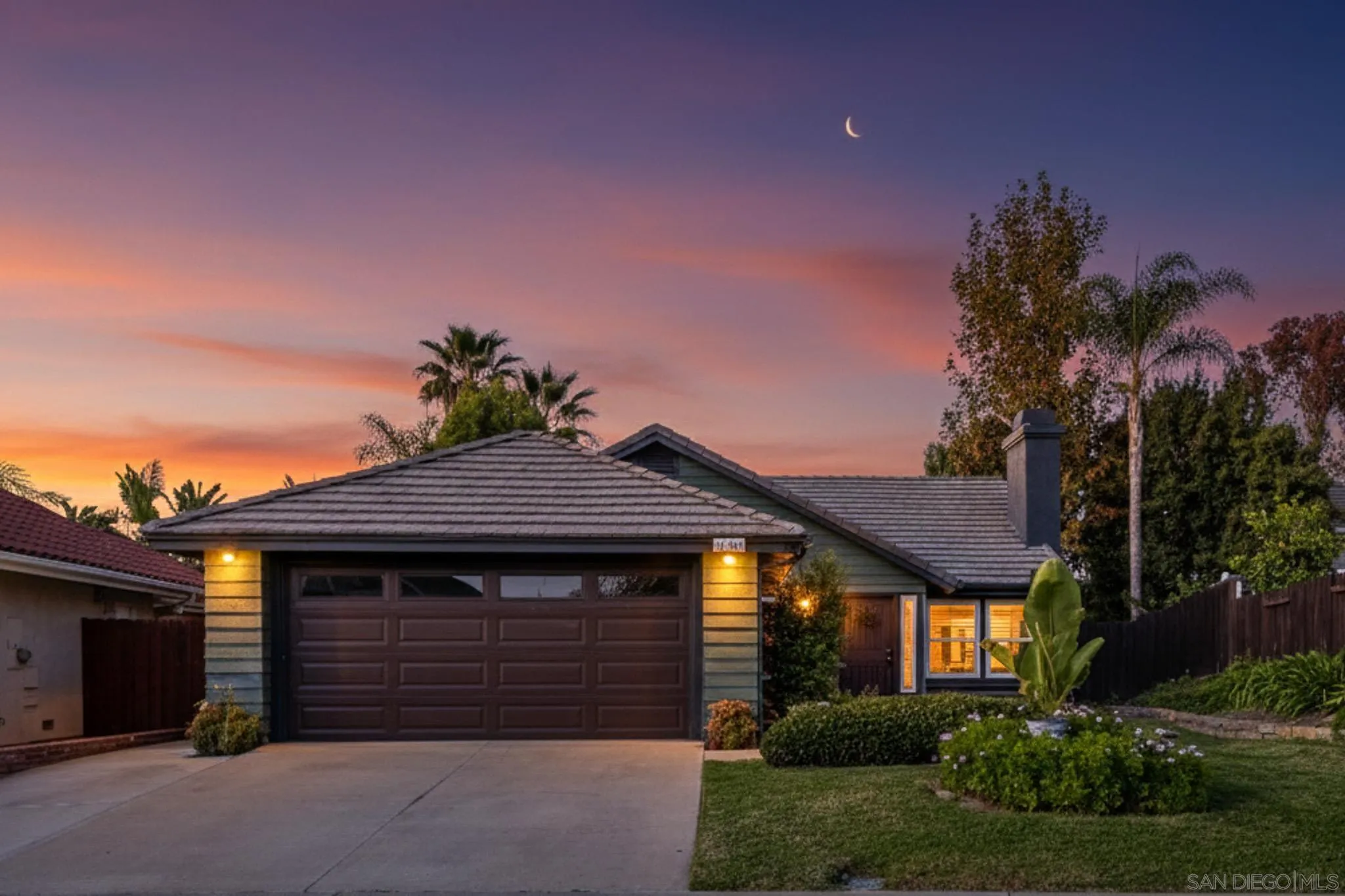 a front view of a house with a garage
