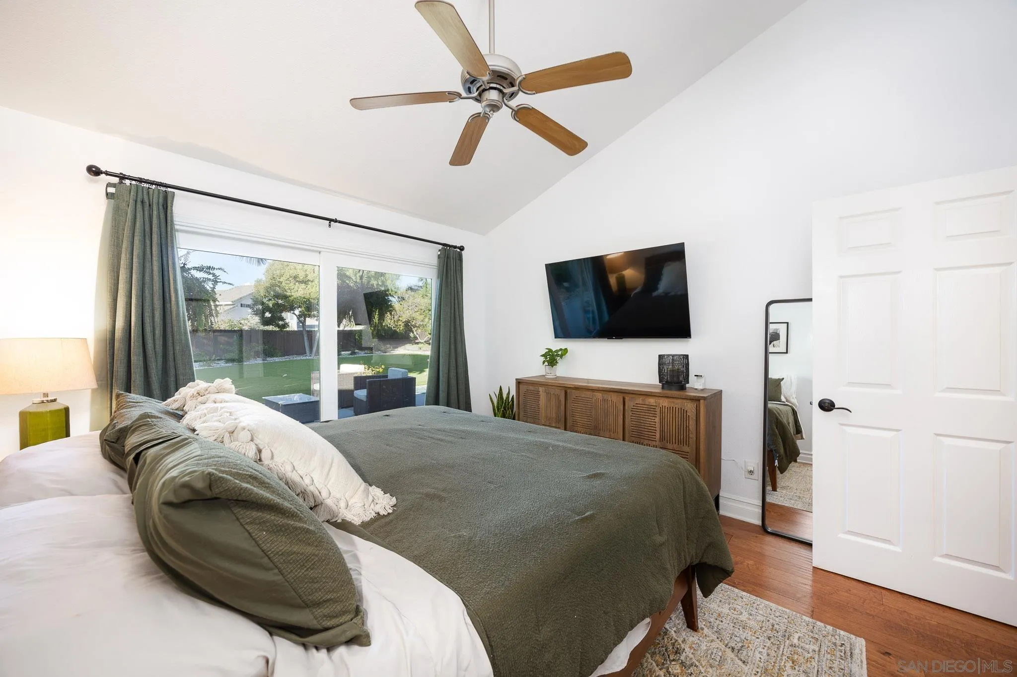 5358 Raspberry Way Oceanside, CA 92057 - Photo 13 of 31 a bedroom with a bed flat screen tv and a large window