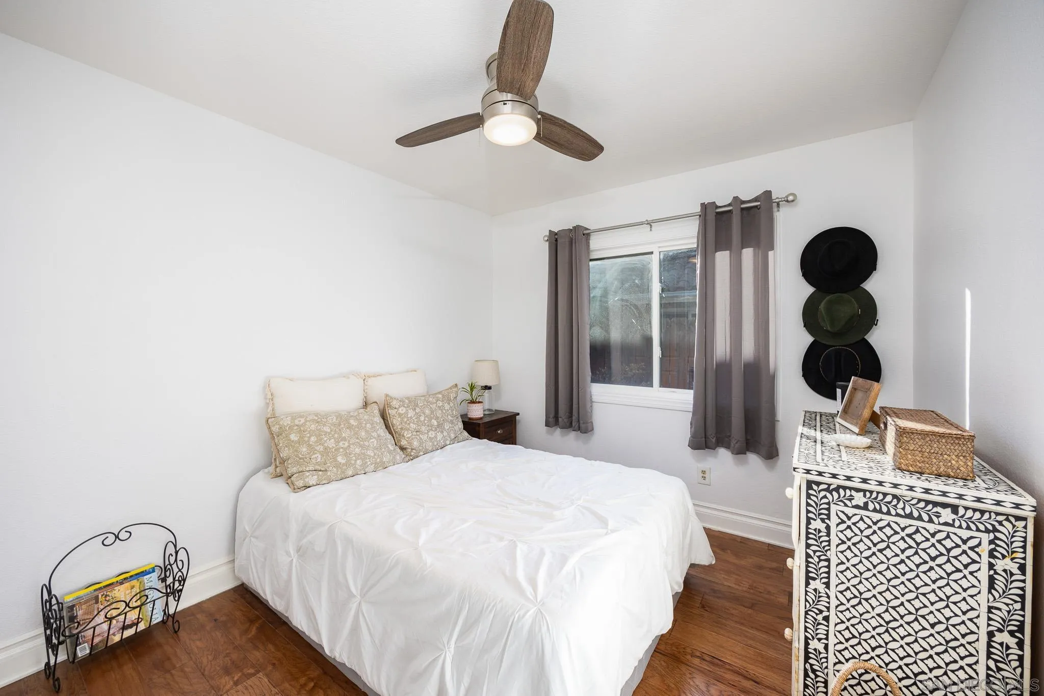 5358 Raspberry Way Oceanside, CA 92057 - Photo 16 of 31 a bedroom with a bed and cabinets