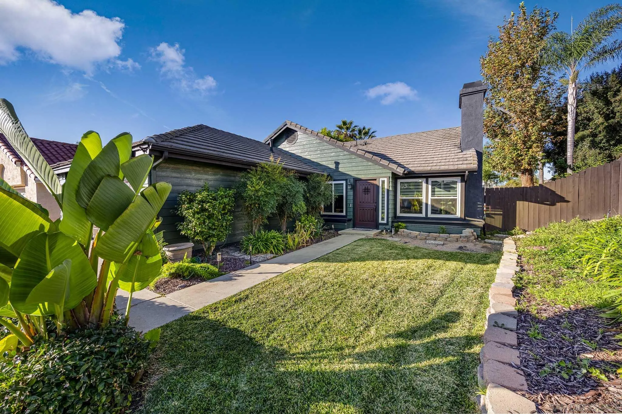 5358 Raspberry Way Oceanside, CA 92057 - Photo 17 of 31 a view of a house with pool plants and large tree