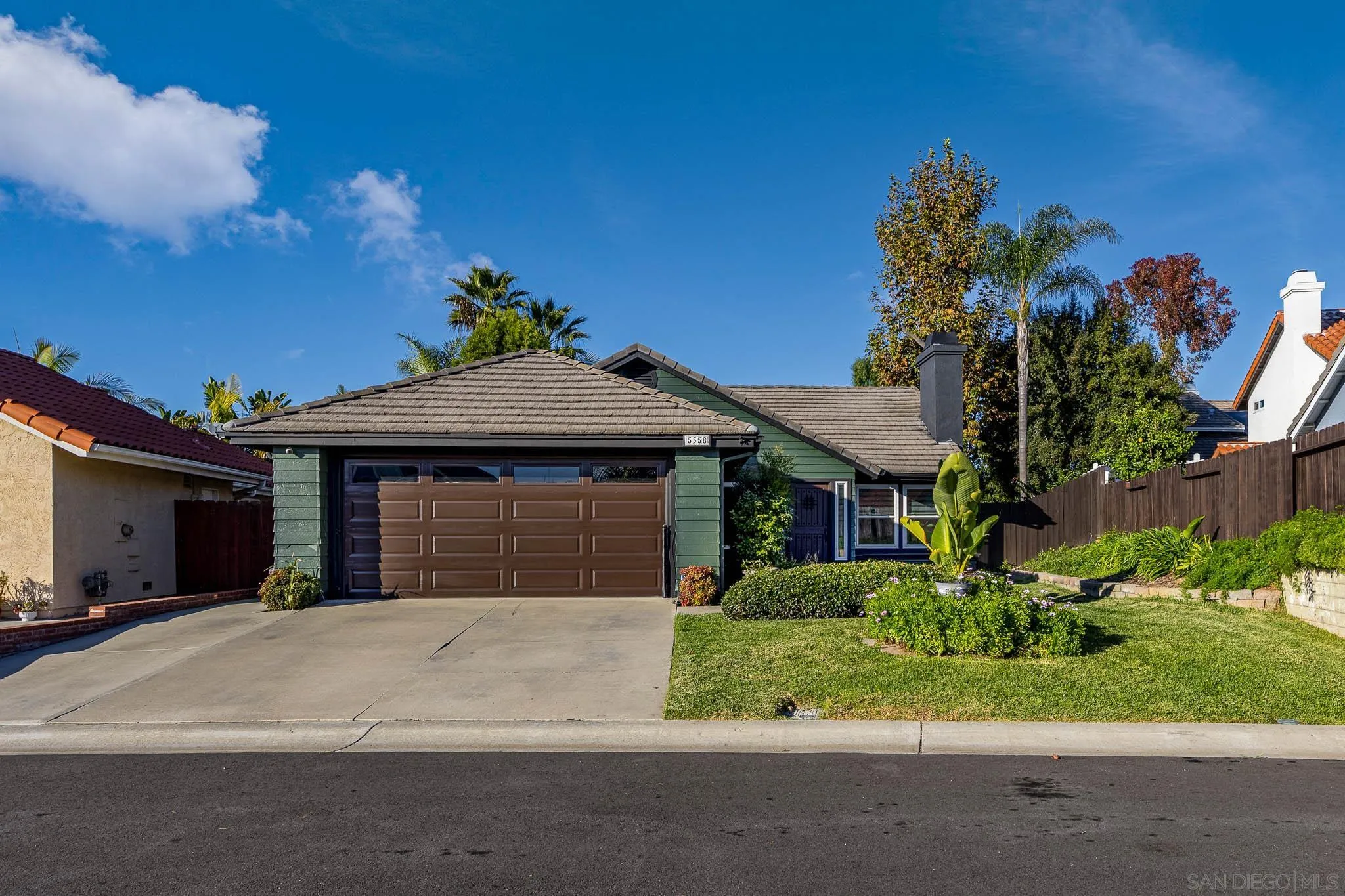 5358 Raspberry Way Oceanside, CA 92057 - Photo 26 of 31 a front view of a house with a yard and garage