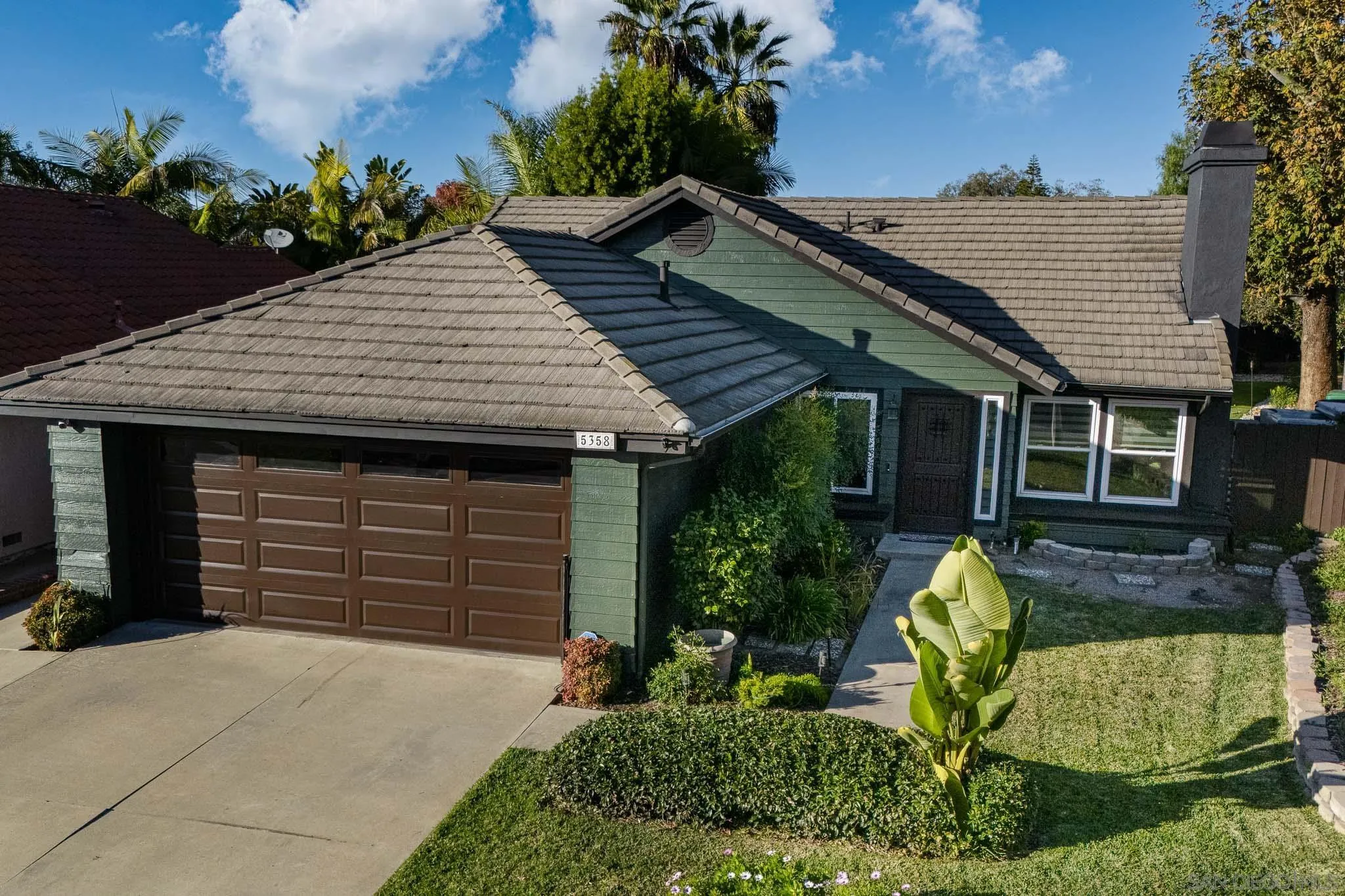 5358 Raspberry Way Oceanside, CA 92057 - Photo 27 of 31 a front view of a house with a garden