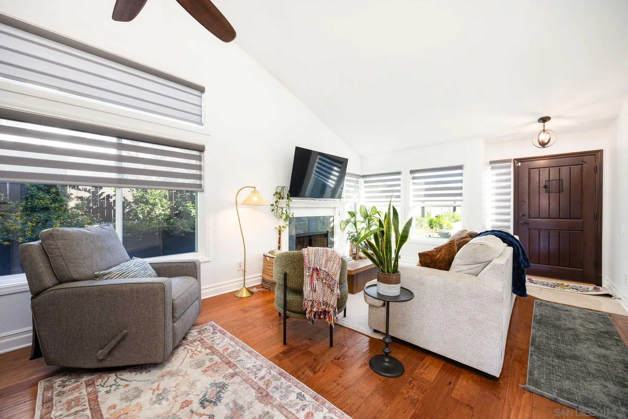 5358 Raspberry Way Oceanside, CA 92057 - Photo 3 of 31 a living room with furniture floor to ceiling window and potted plants