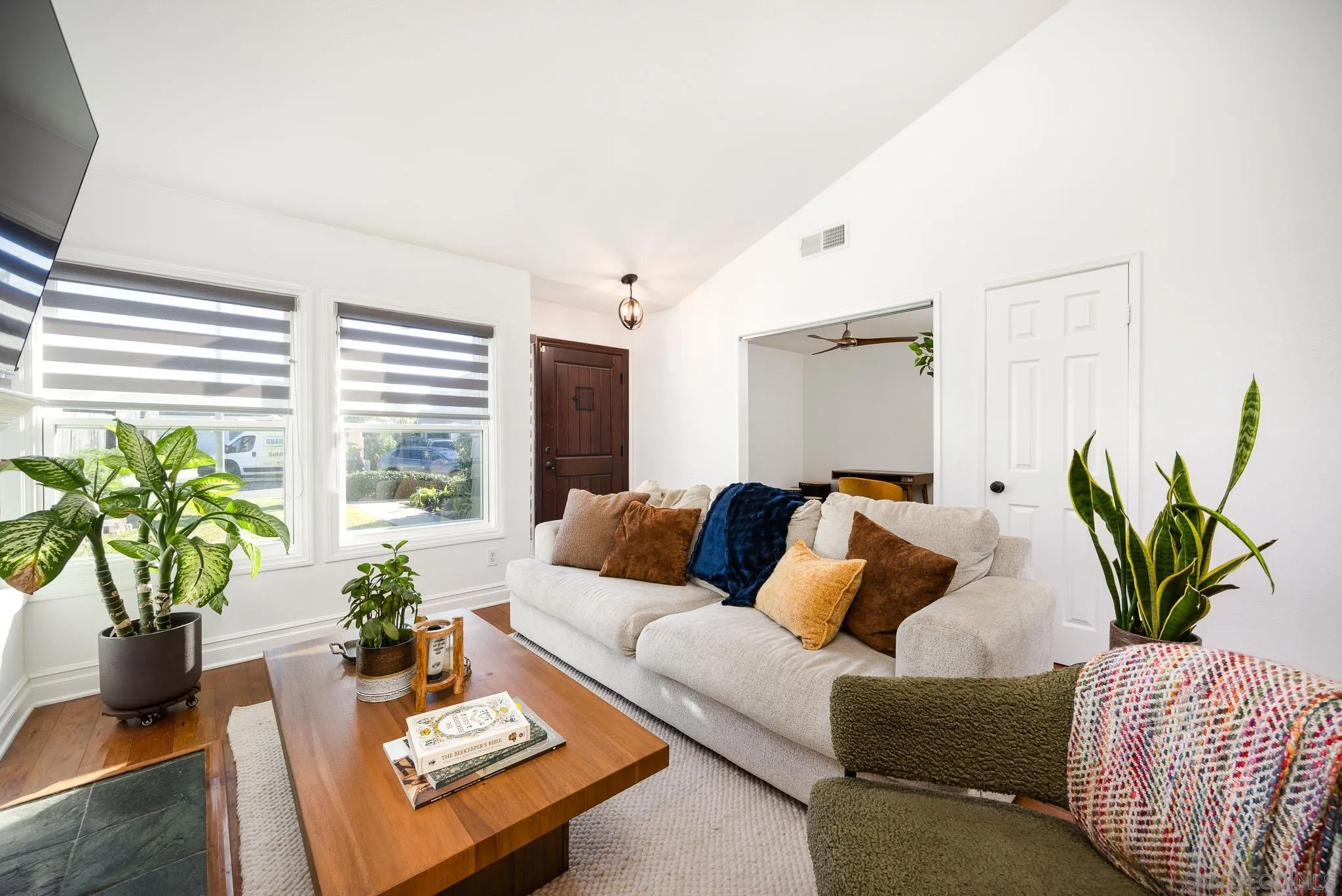 5358 Raspberry Way Oceanside, CA 92057 - Photo 4 of 31 a living room with furniture mirror and a potted plant