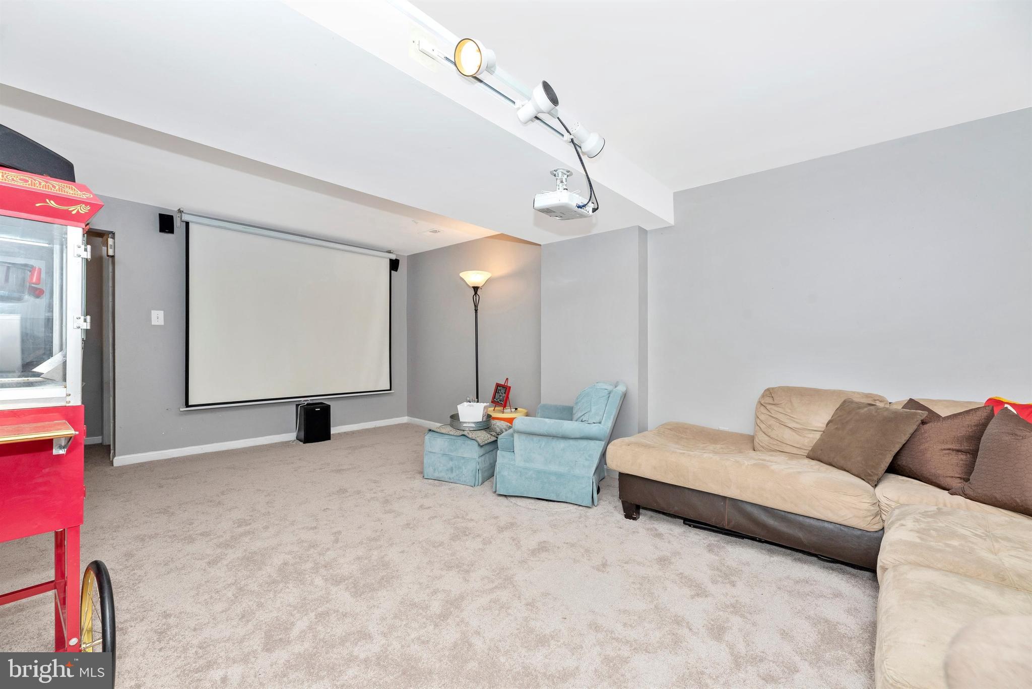 2253 Wetherburne Way Frederick, MD 21702 - Photo 19 of 28 Screen and projector convey
