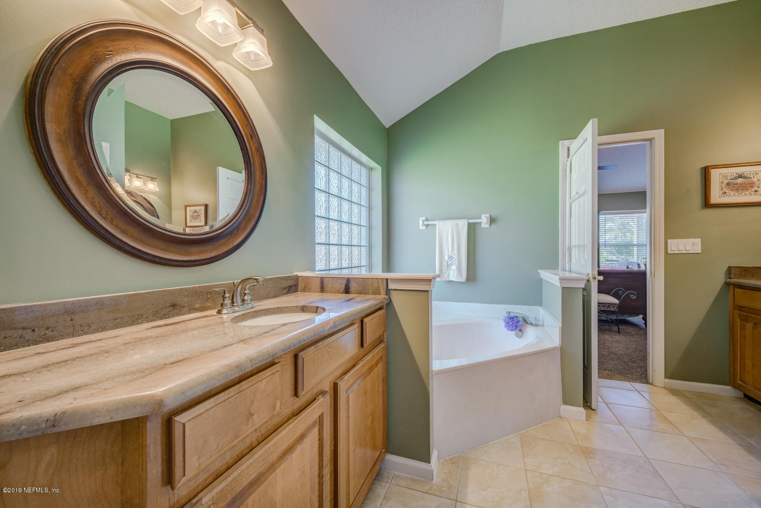 902 East Red House Branch Road St. Augustine, FL 32084 - Photo 11 of 39 a bathroom with a sink and a mirror