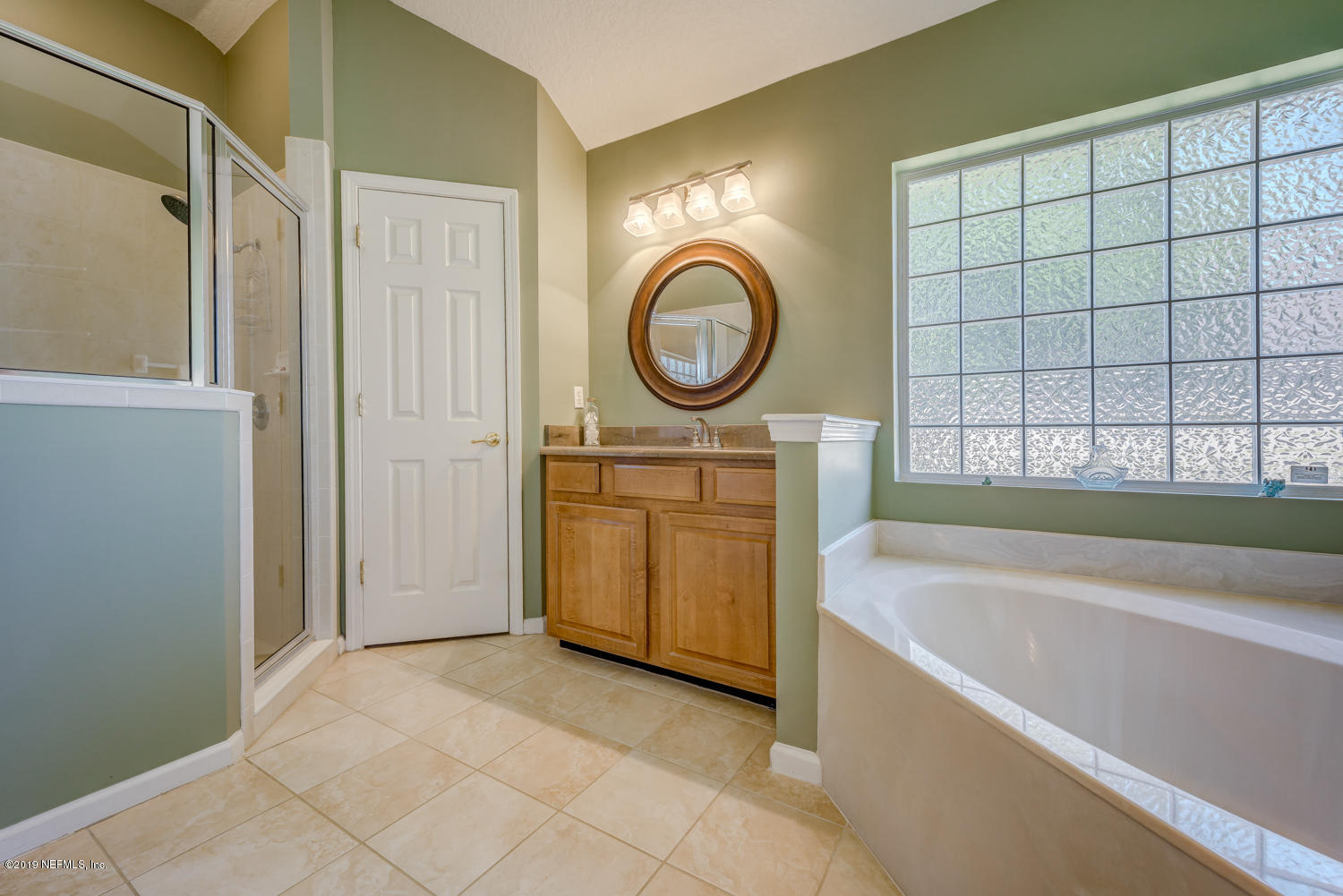 902 East Red House Branch Road St. Augustine, FL 32084 - Photo 12 of 39 a bathroom with a sink a bathtub and a shower