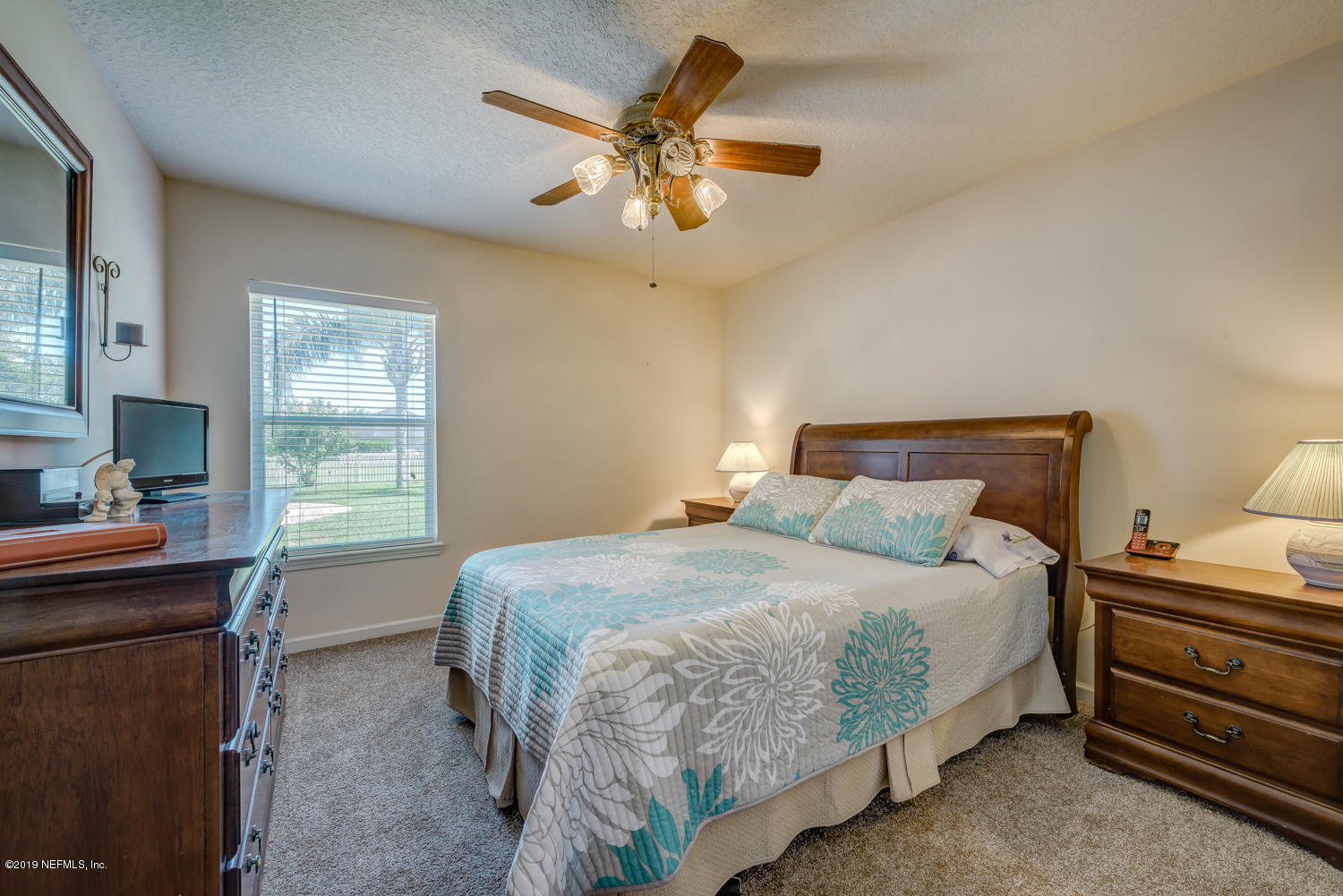 902 East Red House Branch Road St. Augustine, FL 32084 - Photo 13 of 39 a bedroom with a bed and a window