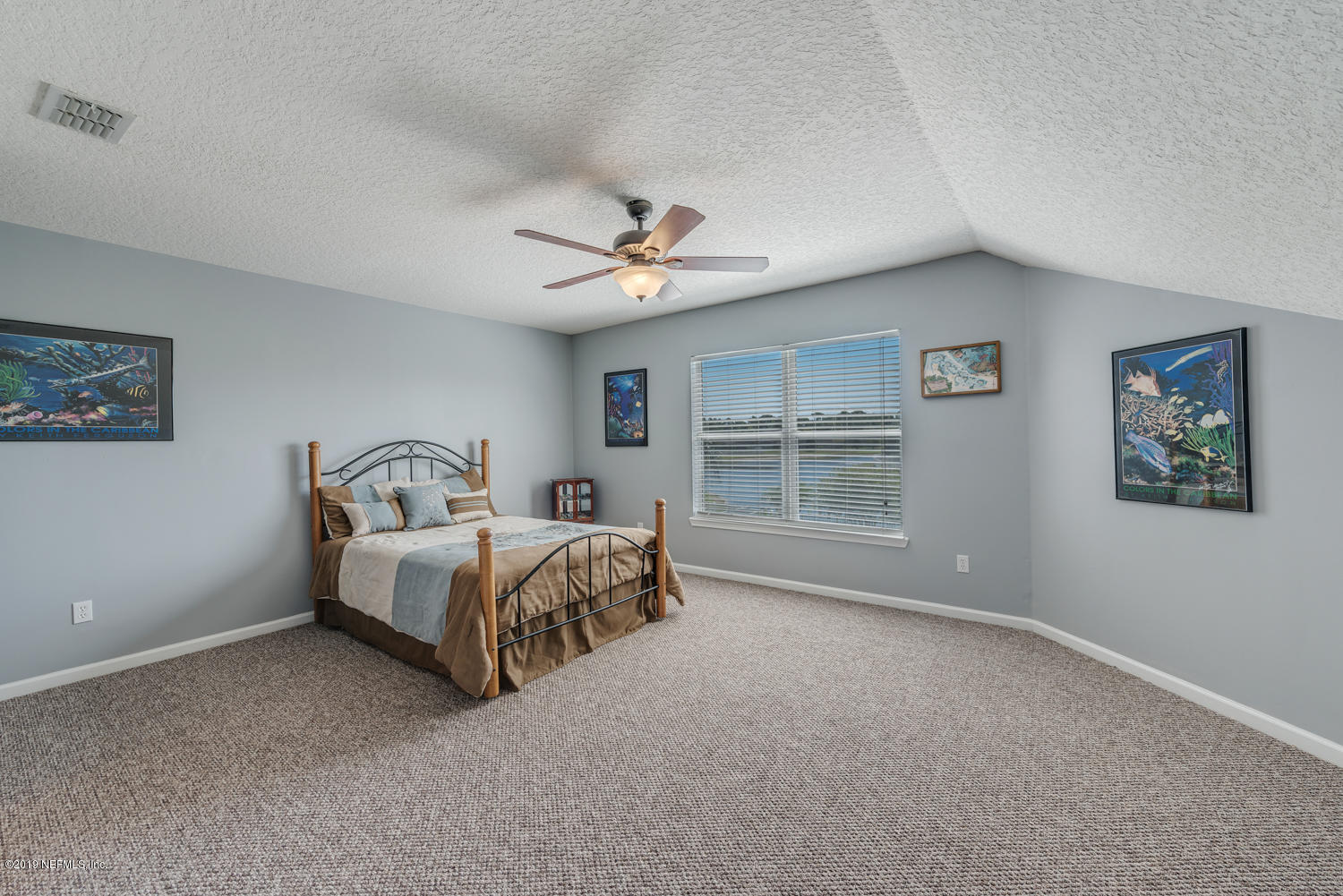 902 East Red House Branch Road St. Augustine, FL 32084 - Photo 14 of 39 a spacious bedroom with a bed and a window