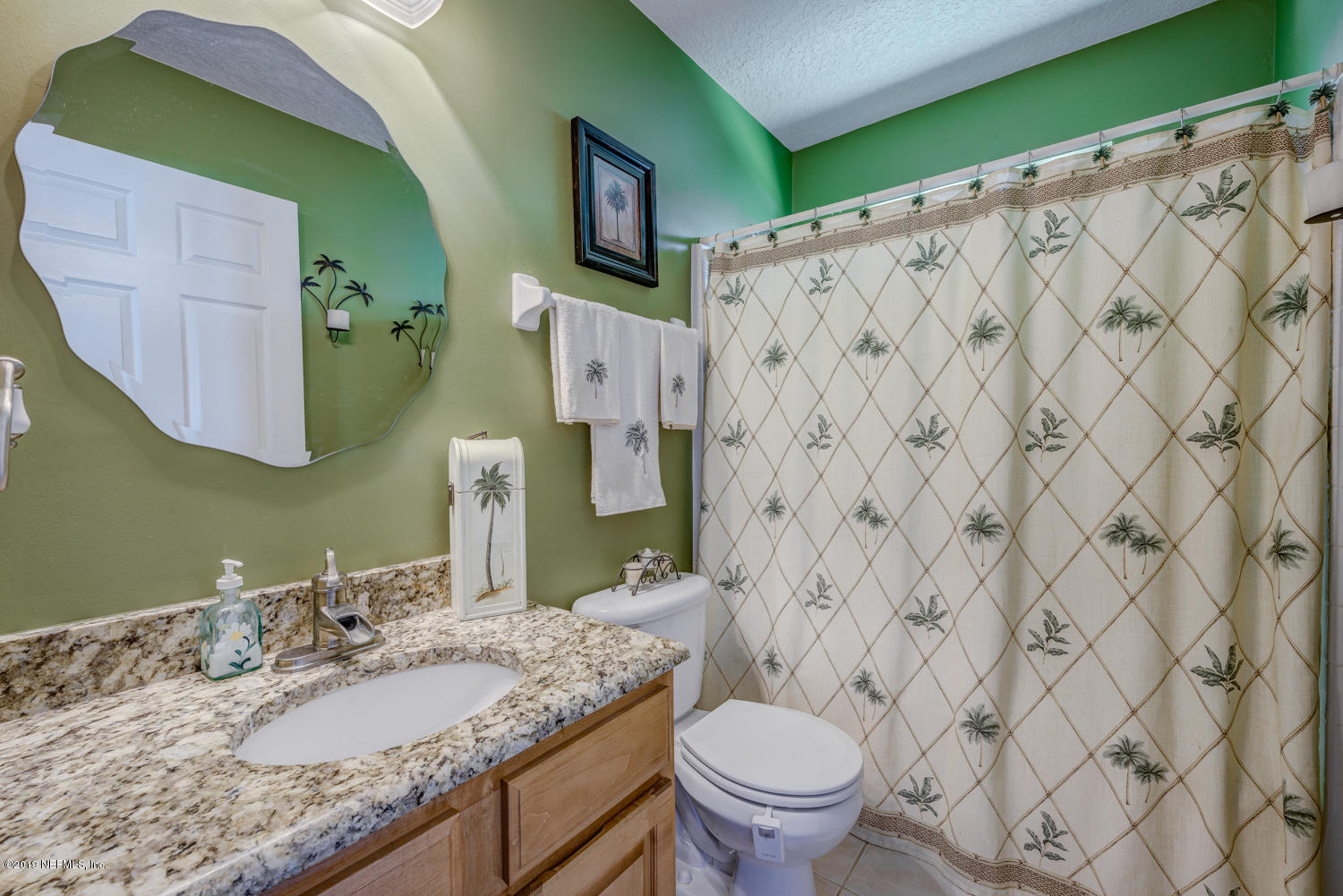 902 East Red House Branch Road St. Augustine, FL 32084 - Photo 15 of 39 a bathroom with a granite countertop sink and a mirror