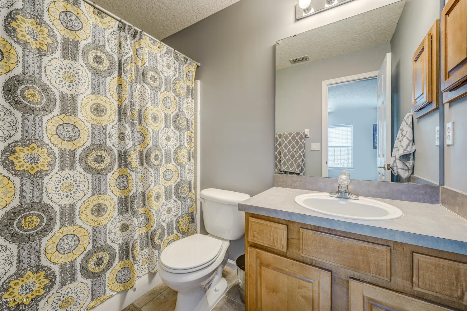 902 East Red House Branch Road St. Augustine, FL 32084 - Photo 16 of 39 a bathroom with a sink and mirror with toilet