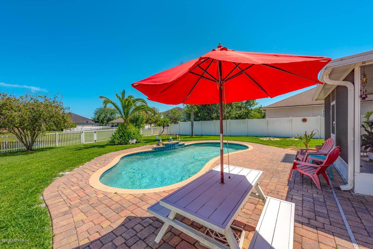 902 East Red House Branch Road St. Augustine, FL 32084 - Photo 20 of 39 an outdoor space with furniture and umbrella