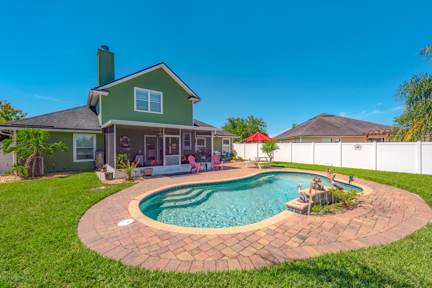 902 East Red House Branch Road St. Augustine, FL 32084 - Photo 22 of 39 a view of a house with swimming pool and yard