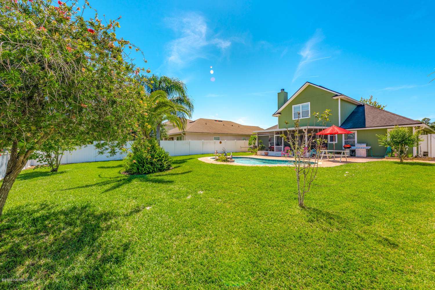 902 East Red House Branch Road St. Augustine, FL 32084 - Photo 26 of 39 a view of an house with a big yard and potted plants