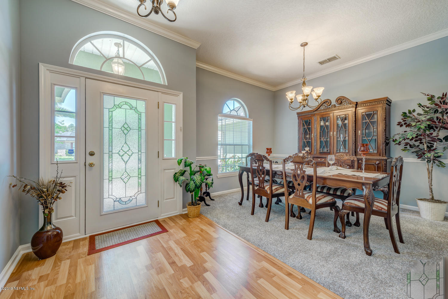 902 East Red House Branch Road St. Augustine, FL 32084 - Photo 3 of 39 a view of a a dining room with furniture window and wooden floor