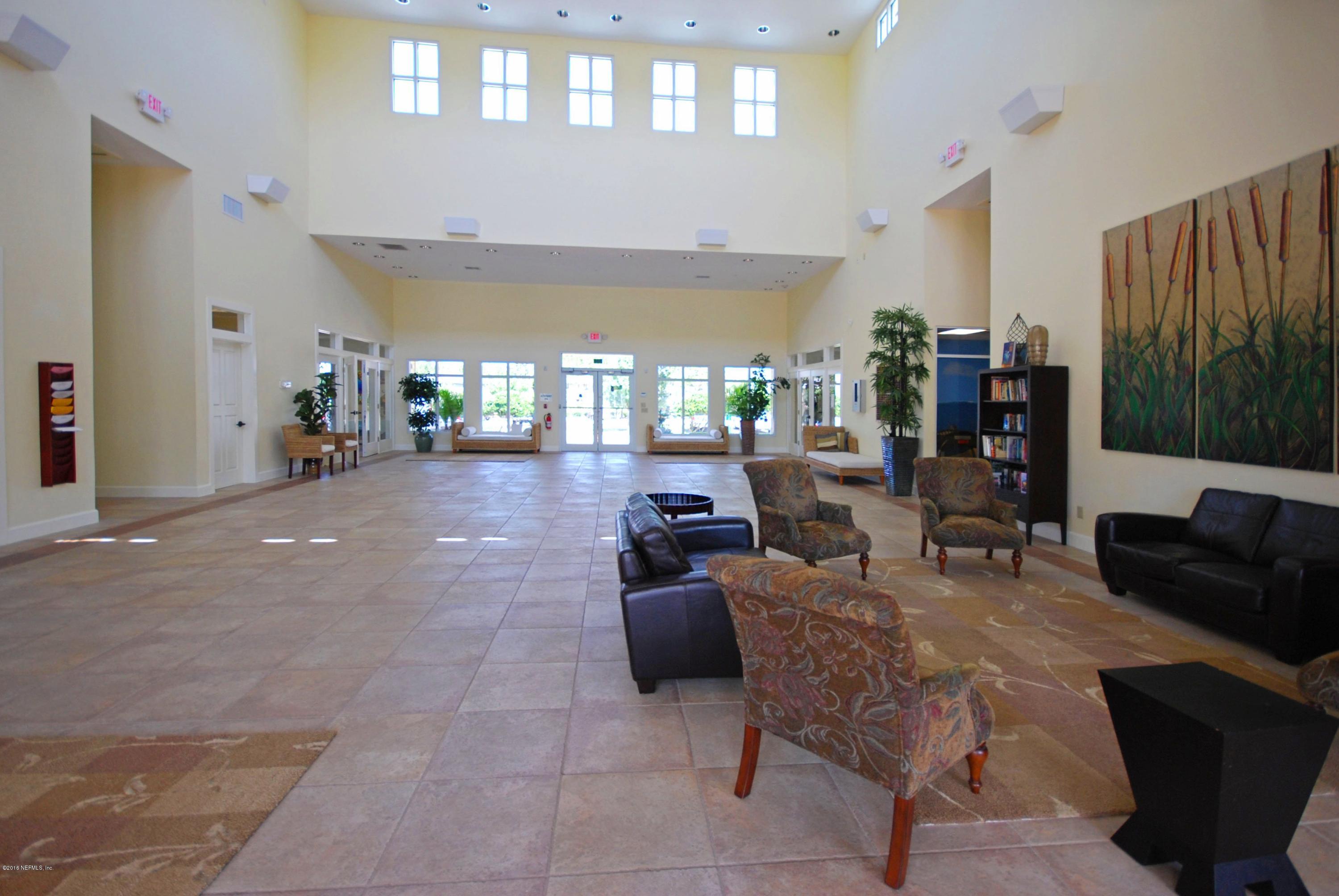 902 East Red House Branch Road St. Augustine, FL 32084 - Photo 31 of 39 a living room with furniture and a flat screen tv