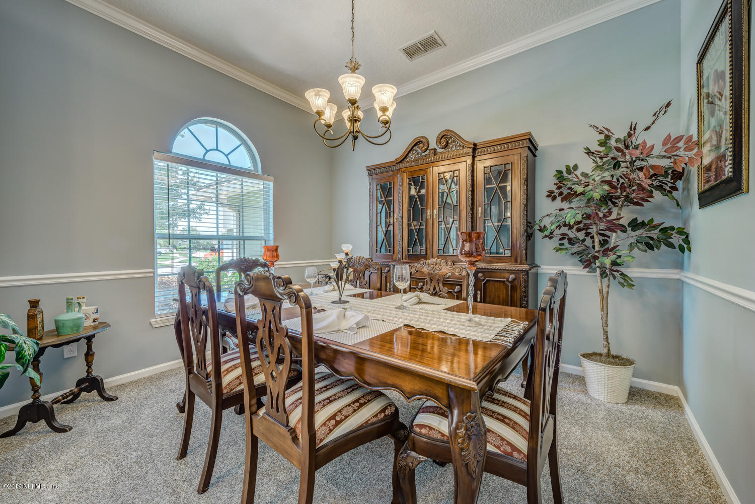 902 East Red House Branch Road St. Augustine, FL 32084 - Photo 4 of 39 a view of a dining room with furniture and chandelier
