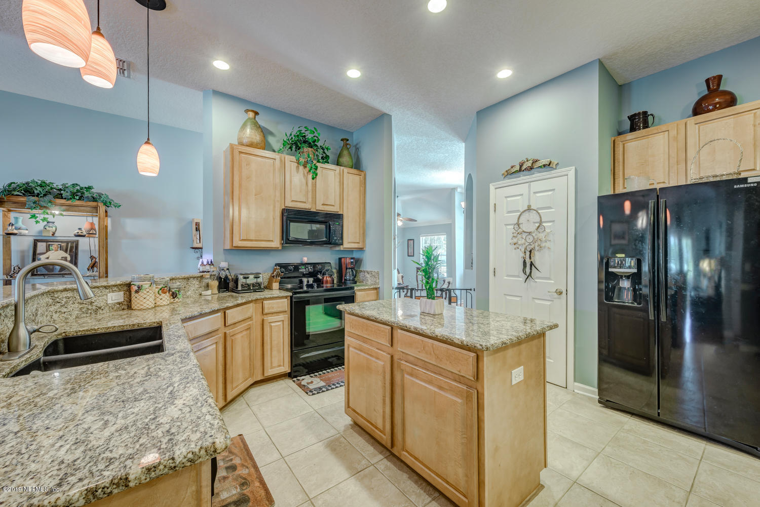 902 East Red House Branch Road St. Augustine, FL 32084 - Photo 7 of 39 a kitchen with stainless steel appliances granite countertop a refrigerator stove and sink