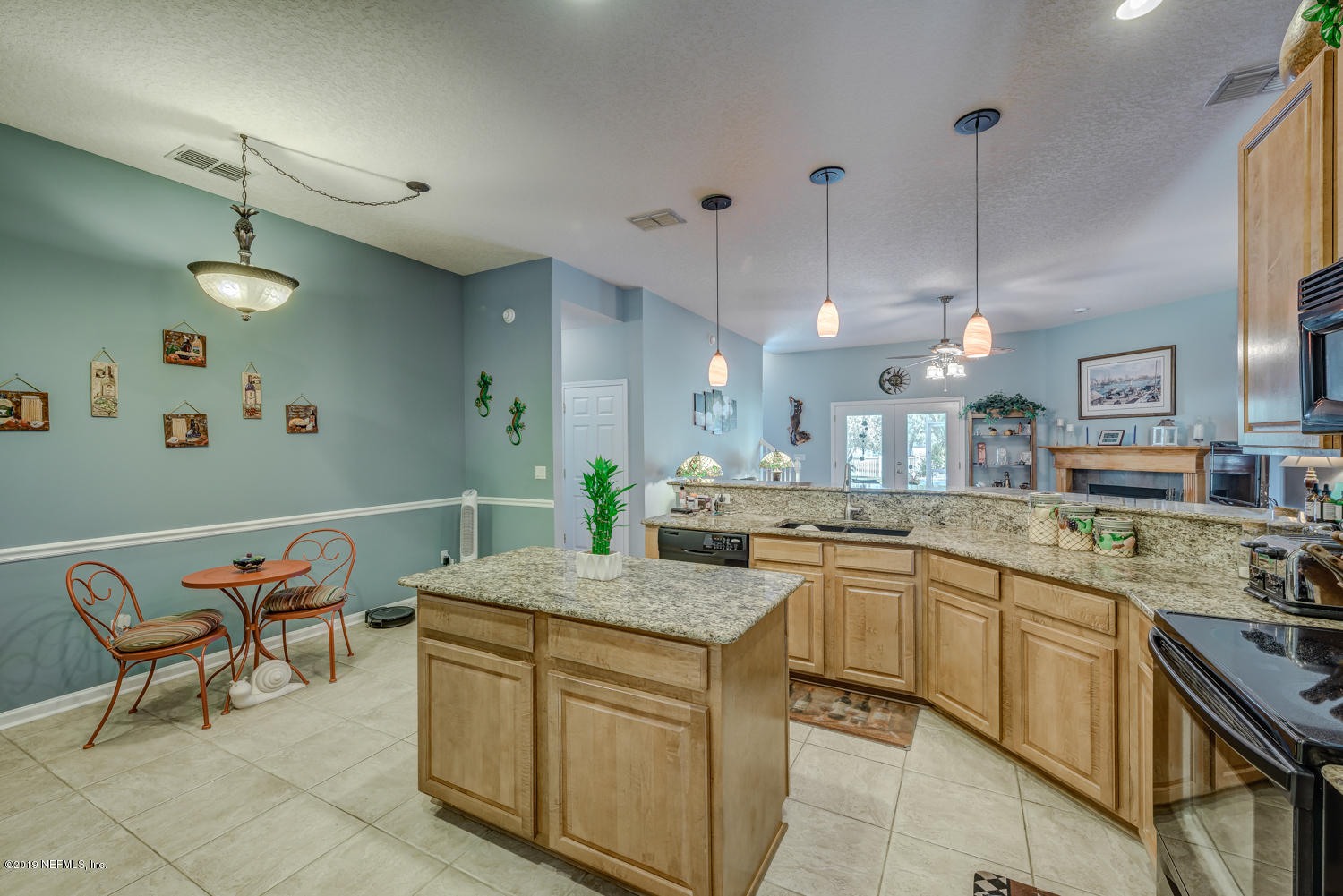 902 East Red House Branch Road St. Augustine, FL 32084 - Photo 8 of 39 a kitchen with a sink and chairs