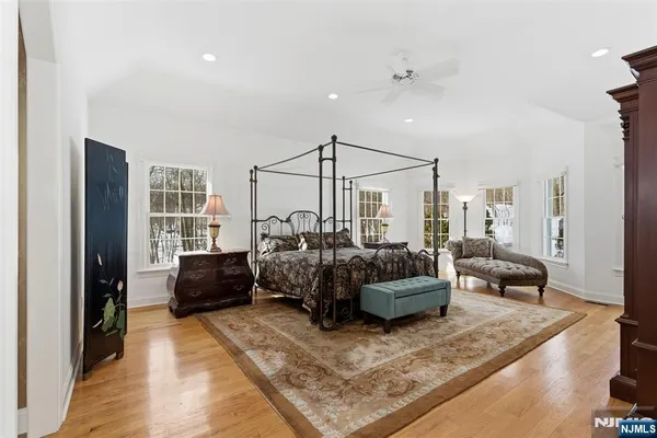 a living room with furniture rug and wooden floor