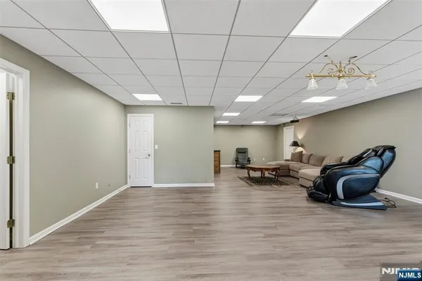 a living room with furniture window and wooden floor