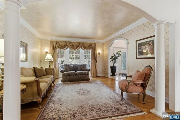 a living room with furniture windows and a rug