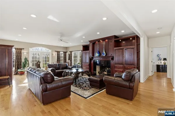 a living room with fireplace furniture and a fireplace