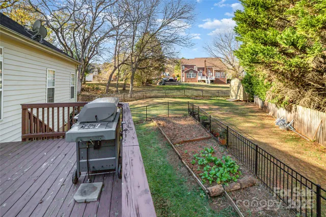 a view of a chairs and table on the wooden deck