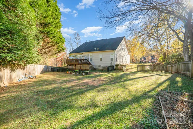 a swimming pool with yard and outdoor seating