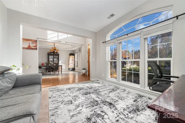 a view of a living room and floor to ceiling window or couch