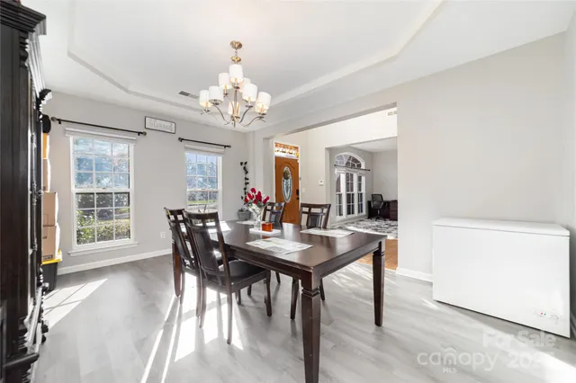 a view of a dining room with furniture window and outside view