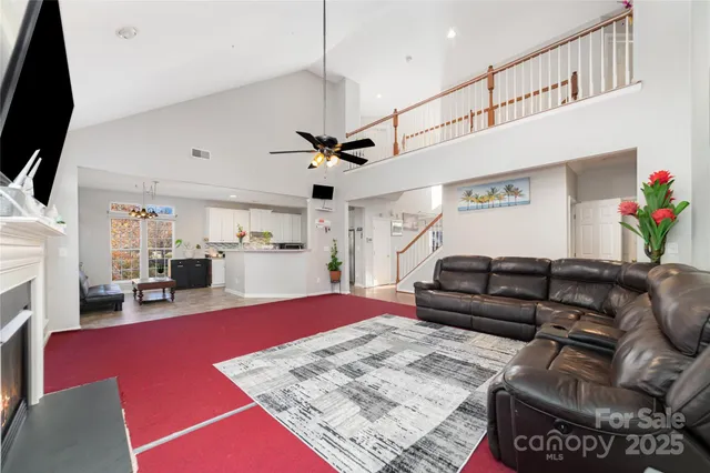 a living room with furniture and a rug