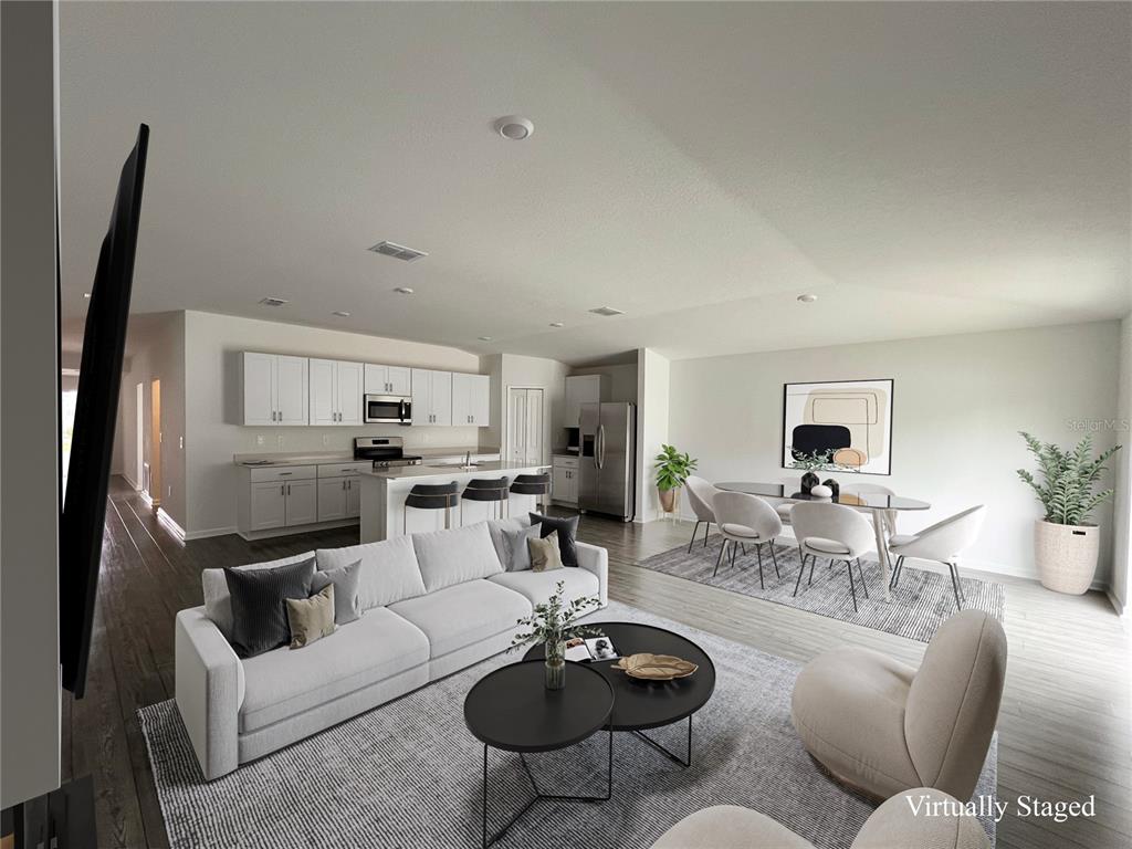 4576 Southwest 84th St Road Ocala, FL 34476 - Photo 2 of 50 a living room with furniture a rug a lamp and a window