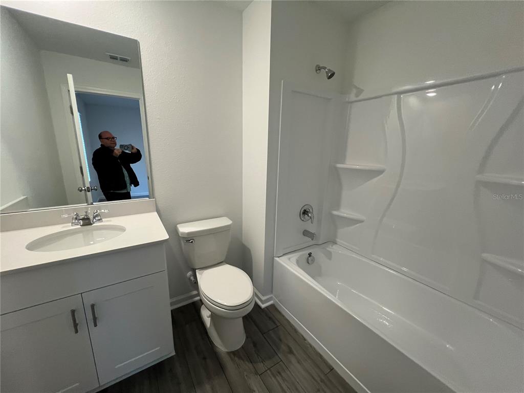 4576 Southwest 84th St Road Ocala, FL 34476 - Photo 22 of 50 a bathroom with a sink toilet and shower