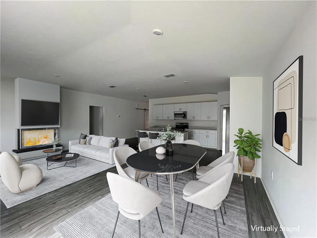 4576 Southwest 84th St Road Ocala, FL 34476 - Photo 3 of 50 a living room with furniture and a flat screen tv