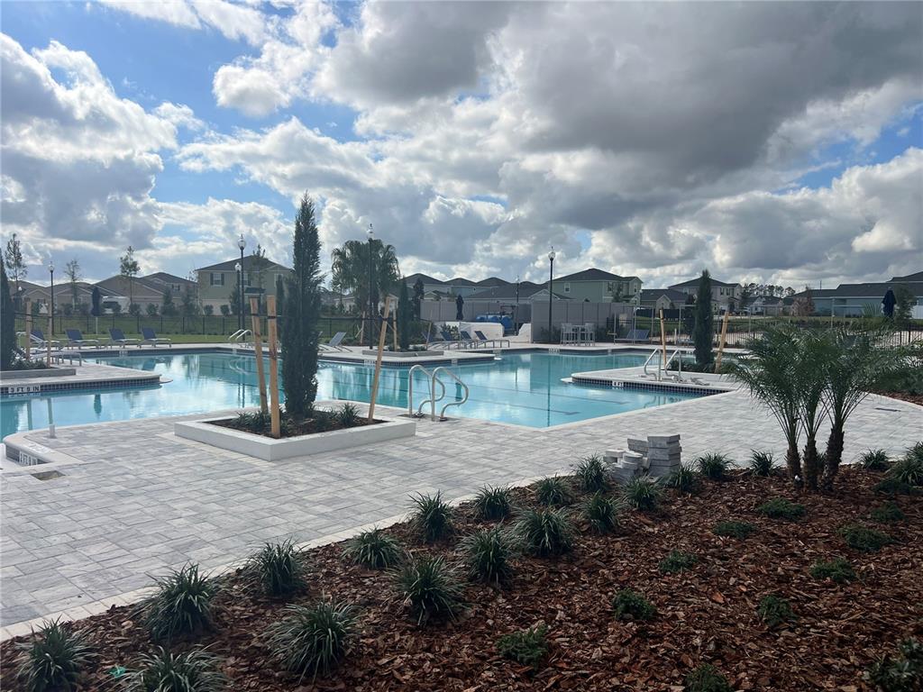 4576 Southwest 84th St Road Ocala, FL 34476 - Photo 36 of 50 a view of a fountain in front of a house