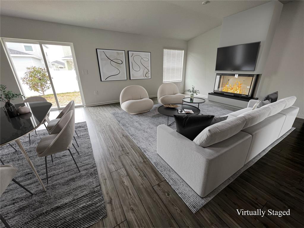 4576 Southwest 84th St Road Ocala, FL 34476 - Photo 4 of 50 a living room with furniture and a flat screen tv